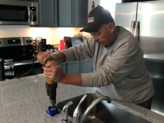 another reason to hire a Professional Plumber Drilling granite countertop for reverse osmosis